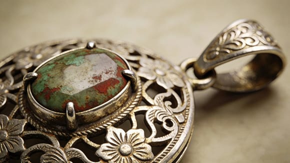 Metal patina and design style details for antique jewelry